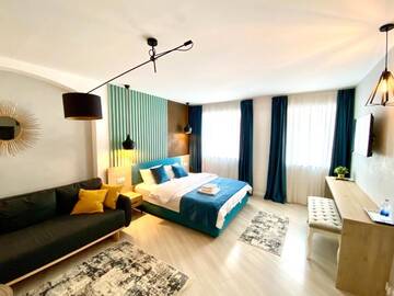 Фото номера Семейный полулюкс Отель Lumiere House Sibiu г. Сибиу 2