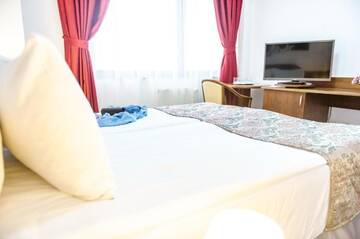 Фото номера Двухместный номер с 2 отдельными кроватями Отель Hotel Parc Sibiu г. Сибиу 8